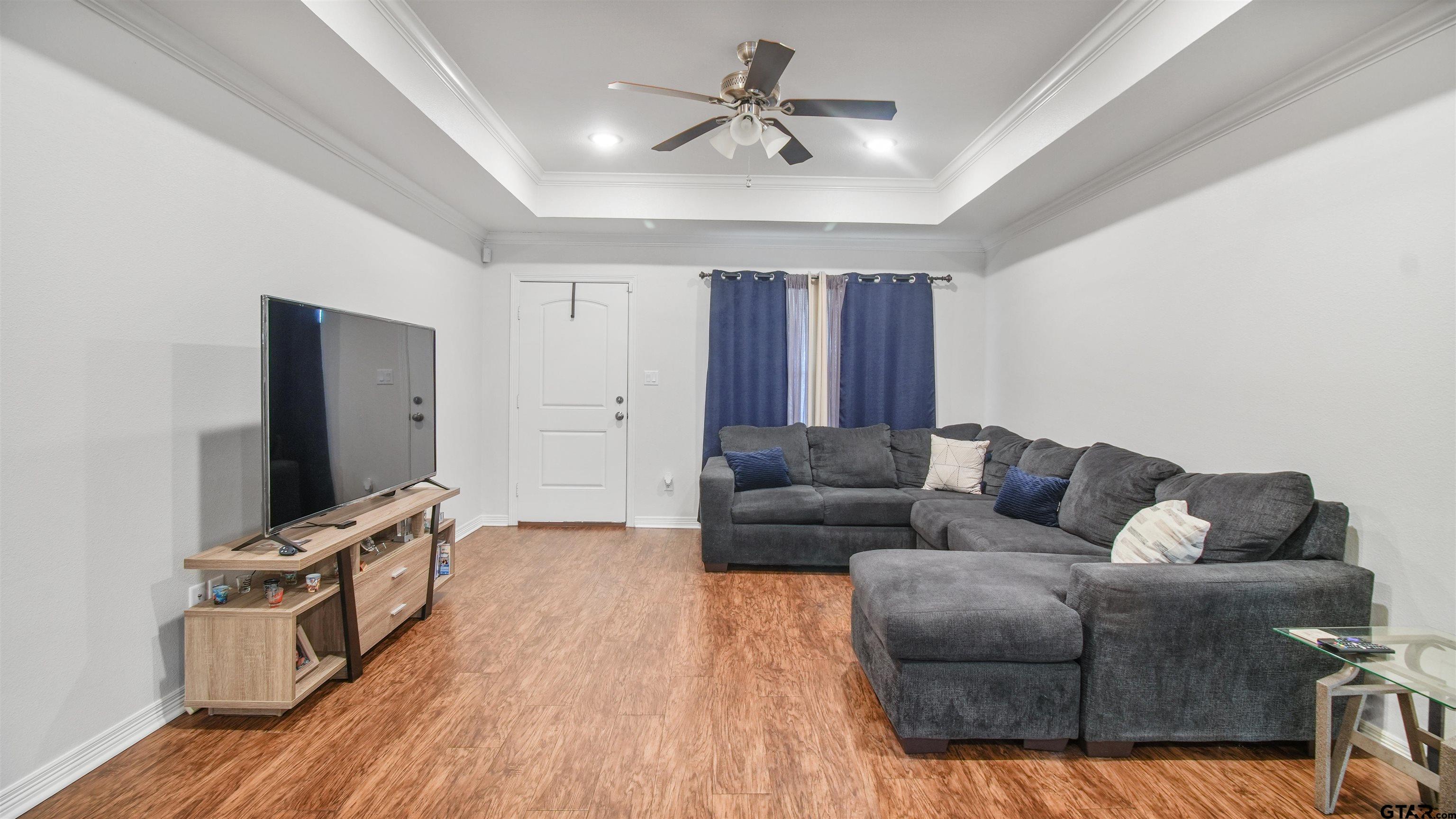 2220 Walton Road Tyler, TX 75701 - Photo 8 of 29 a living room with furniture and a flat screen tv