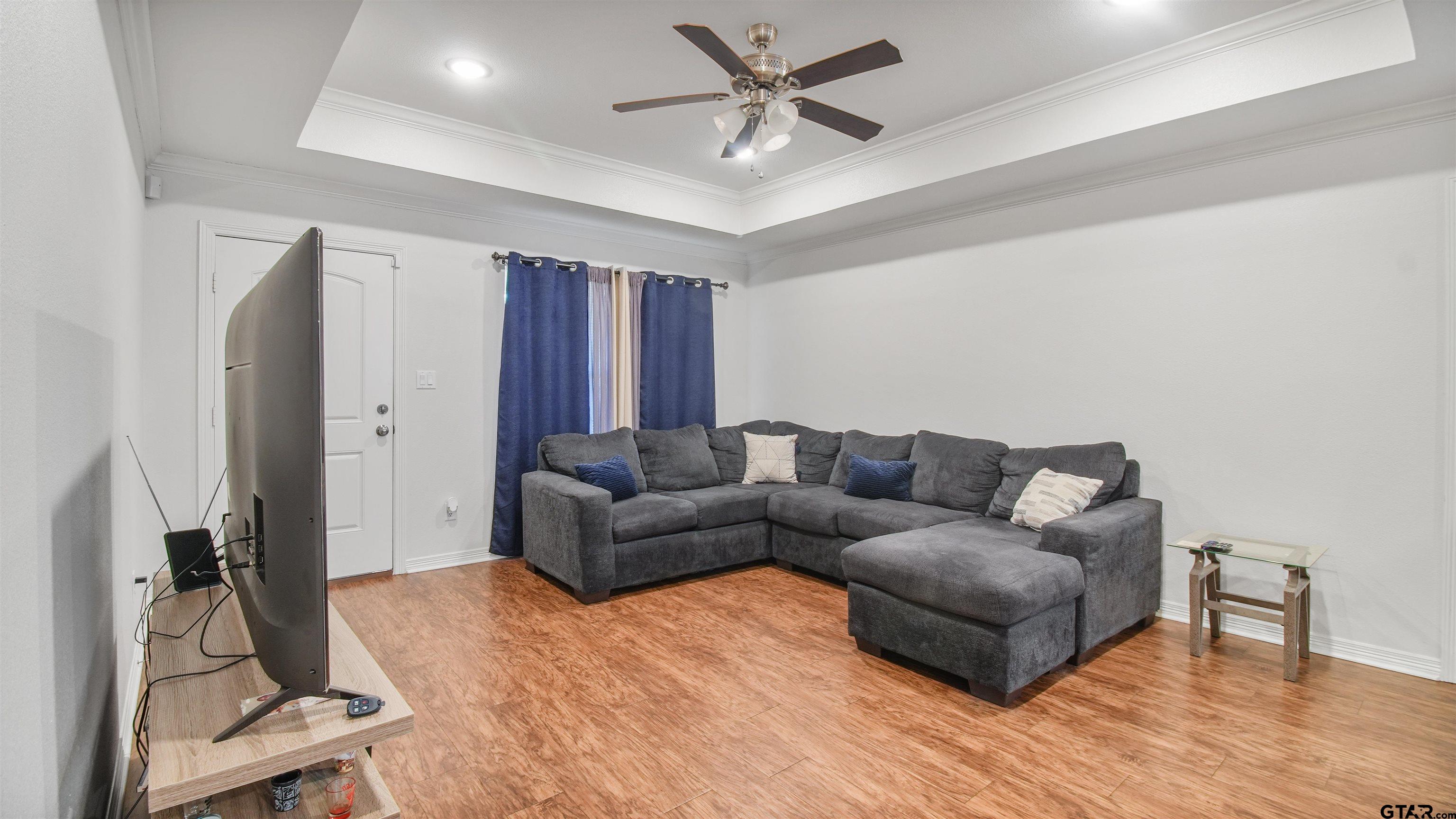 2220 Walton Road Tyler, TX 75701 - Photo 9 of 29 a living room with furniture and a flat screen tv
