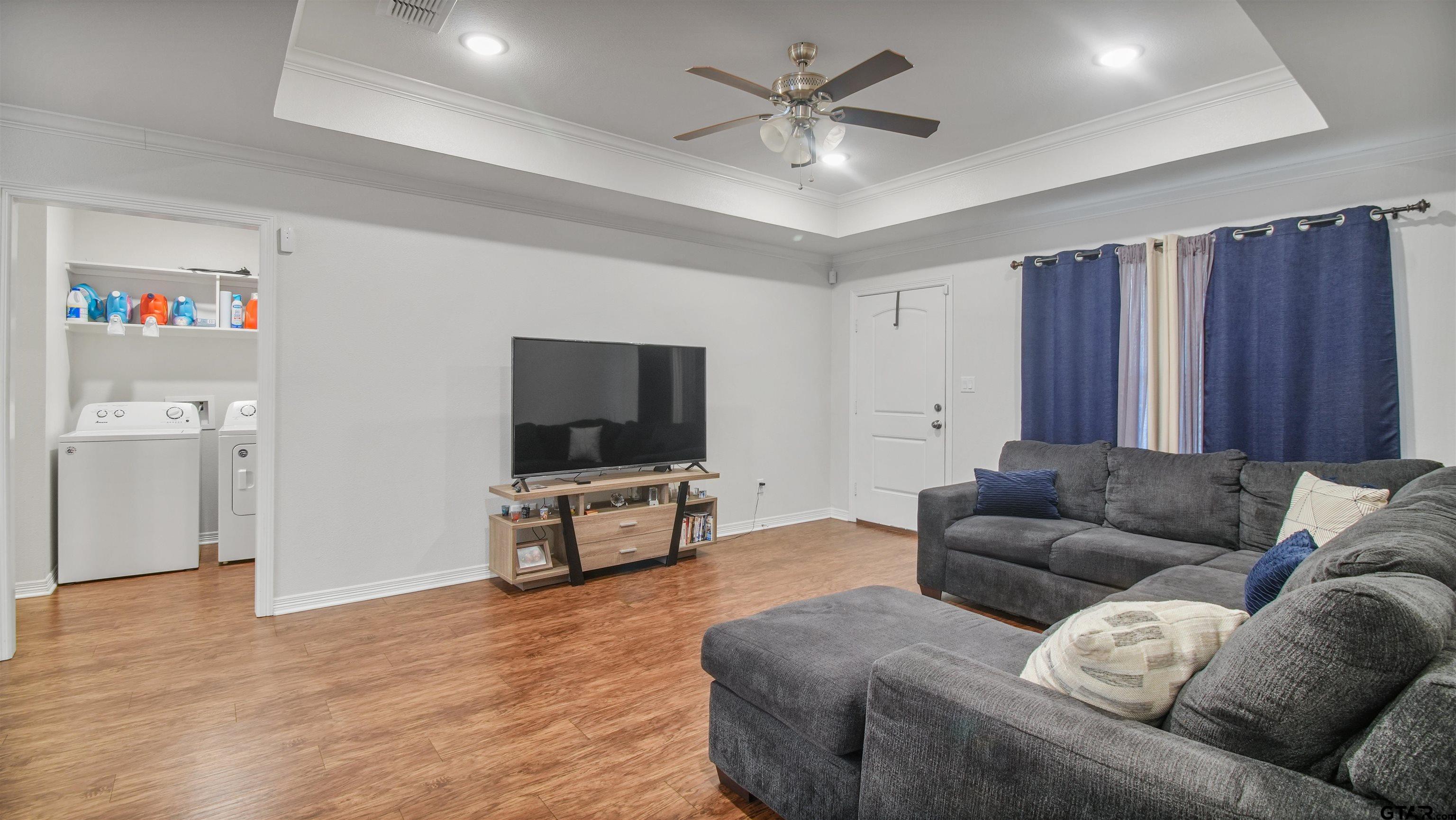 2220 Walton Road Tyler, TX 75701 - Photo 10 of 29 a living room with furniture and a flat screen tv