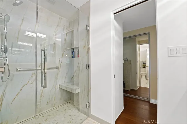 a bathroom with a shower and toilet