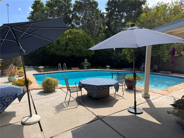 a view of a swimming pool with a patio