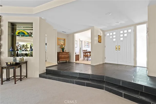 a view of living room filled with furniture and window