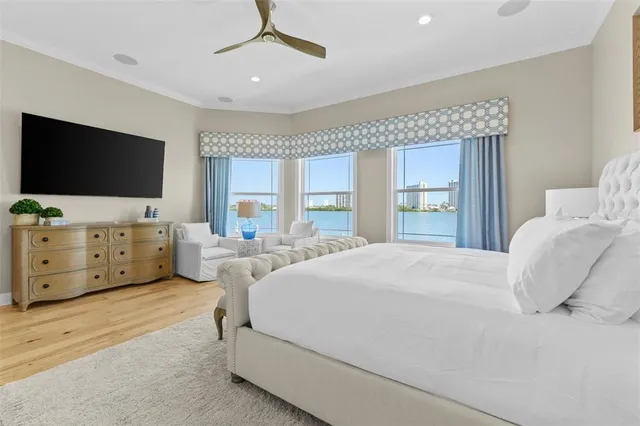 a bathroom with a granite countertop shower a mirror and window