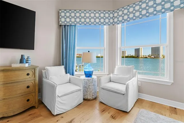 a large kitchen with kitchen island a stove a sink a dining table and chairs