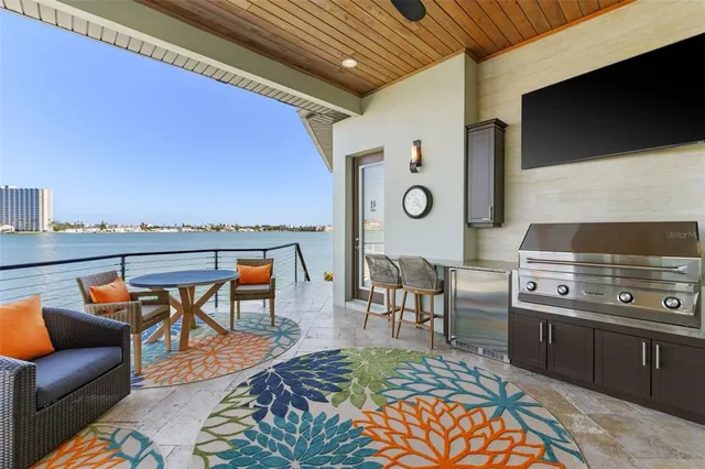 a view of a house with swimming pool and sitting area