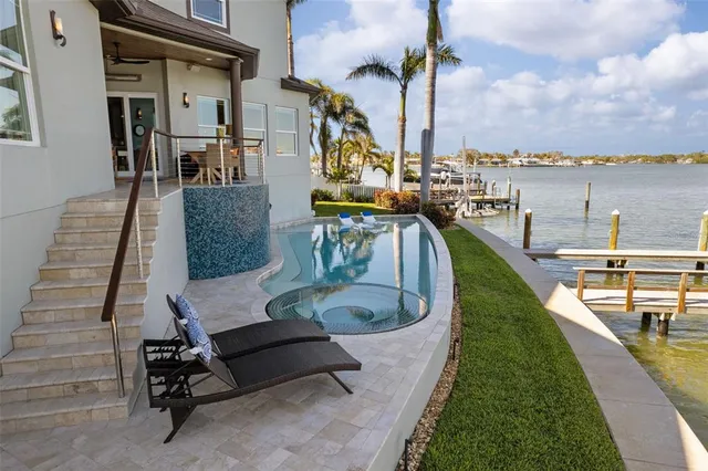 an aerial view of a house with a lake view