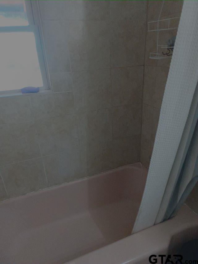 584 County Road 302 Carthage, TX 75633 - Photo 12 of 27 a close up of a bathtub