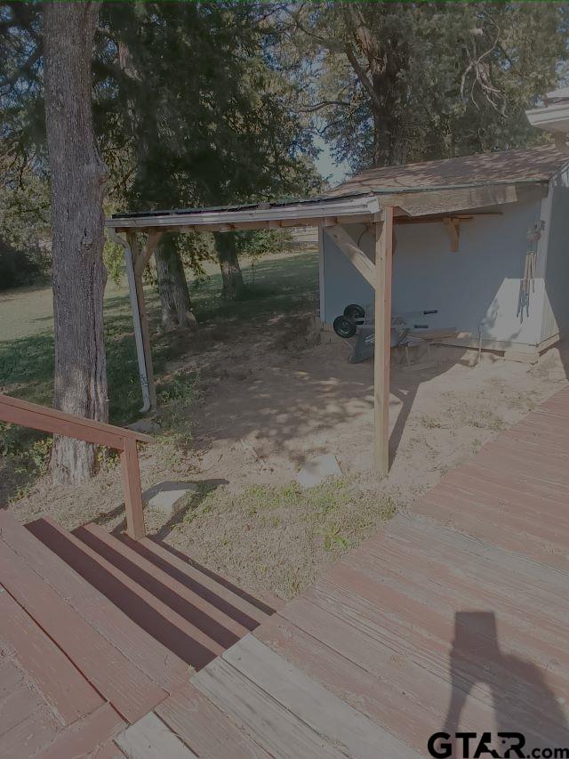 584 County Road 302 Carthage, TX 75633 - Photo 18 of 27 a backyard of a house