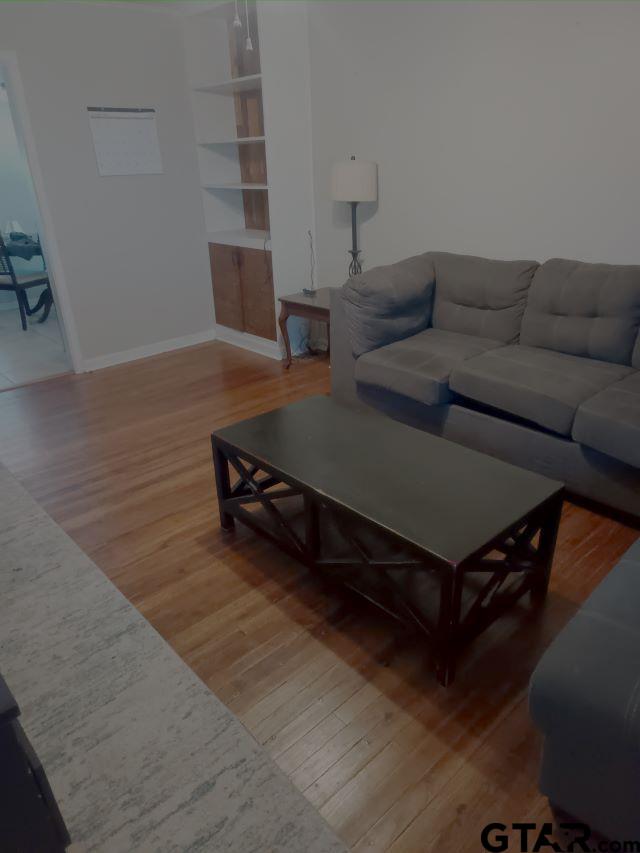 584 County Road 302 Carthage, TX 75633 - Photo 5 of 27 a living room with furniture and a wooden floor