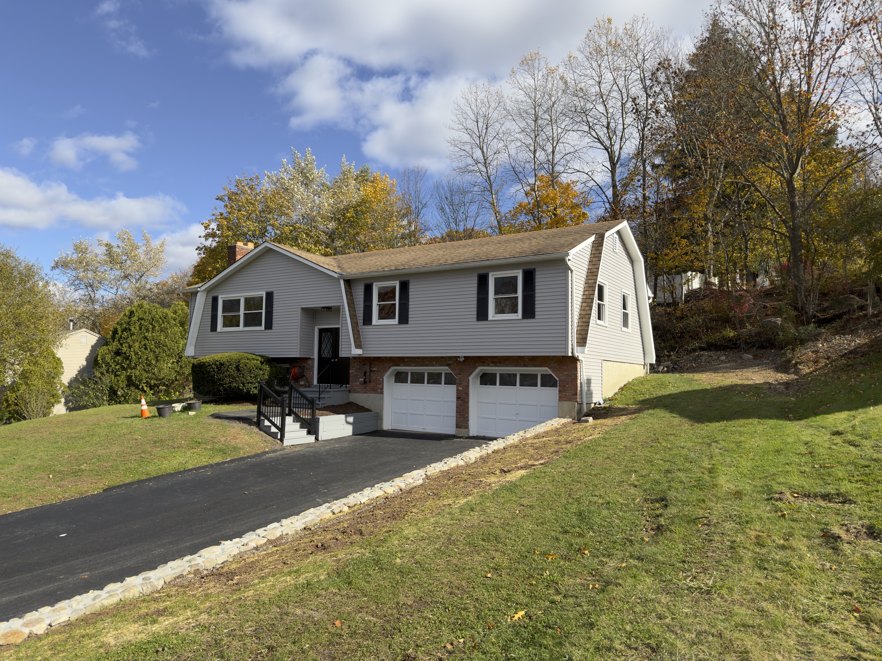 63 Haddad Road Waterbury, CT 06708 - Photo 11 of 30 a view of a house with backyard and sitting area