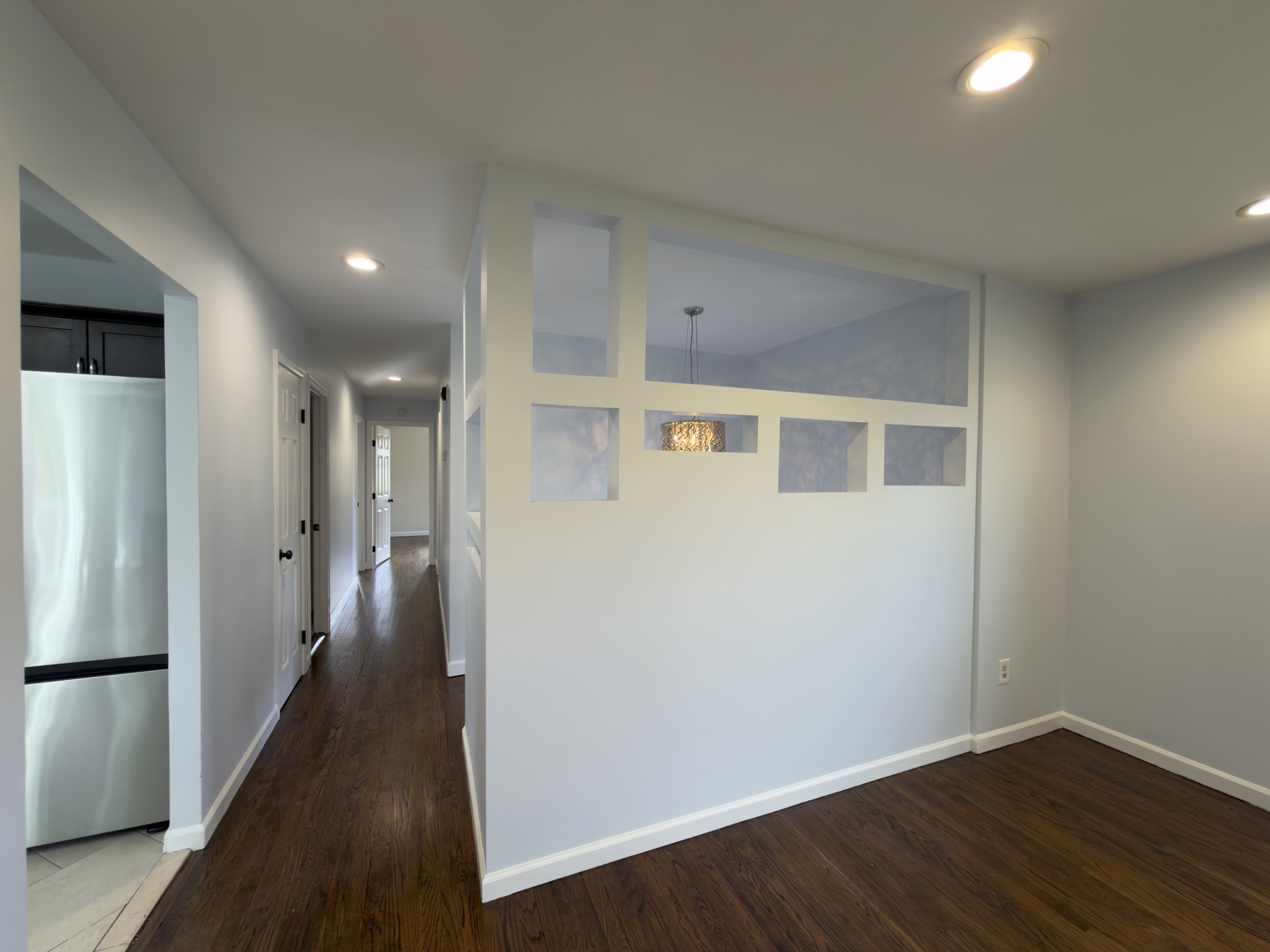 63 Haddad Road Waterbury, CT 06708 - Photo 15 of 30 a view of a hallway with wooden floor