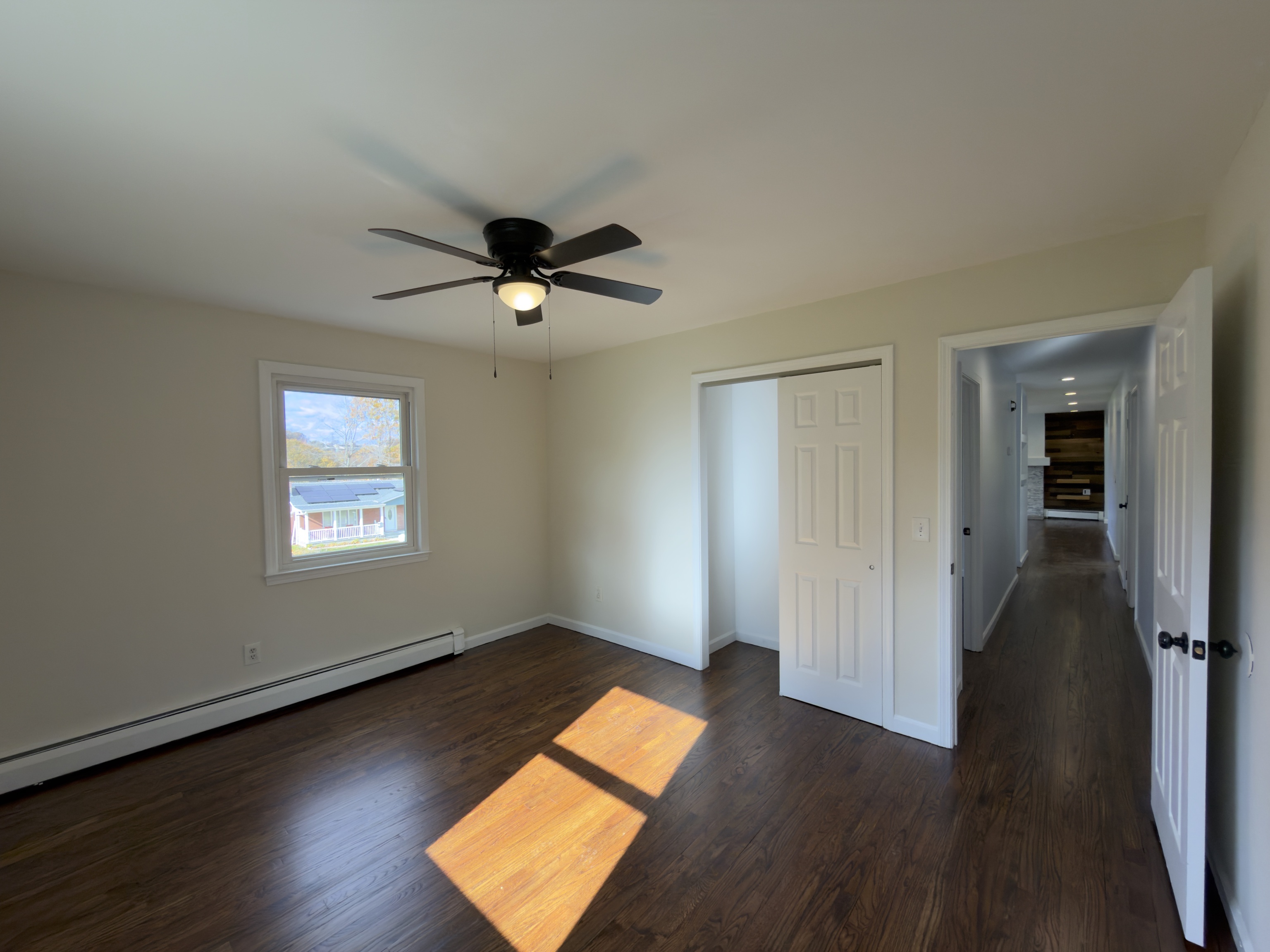 63 Haddad Road Waterbury, CT 06708 - Photo 27 of 30 an empty room with wooden floor and windows