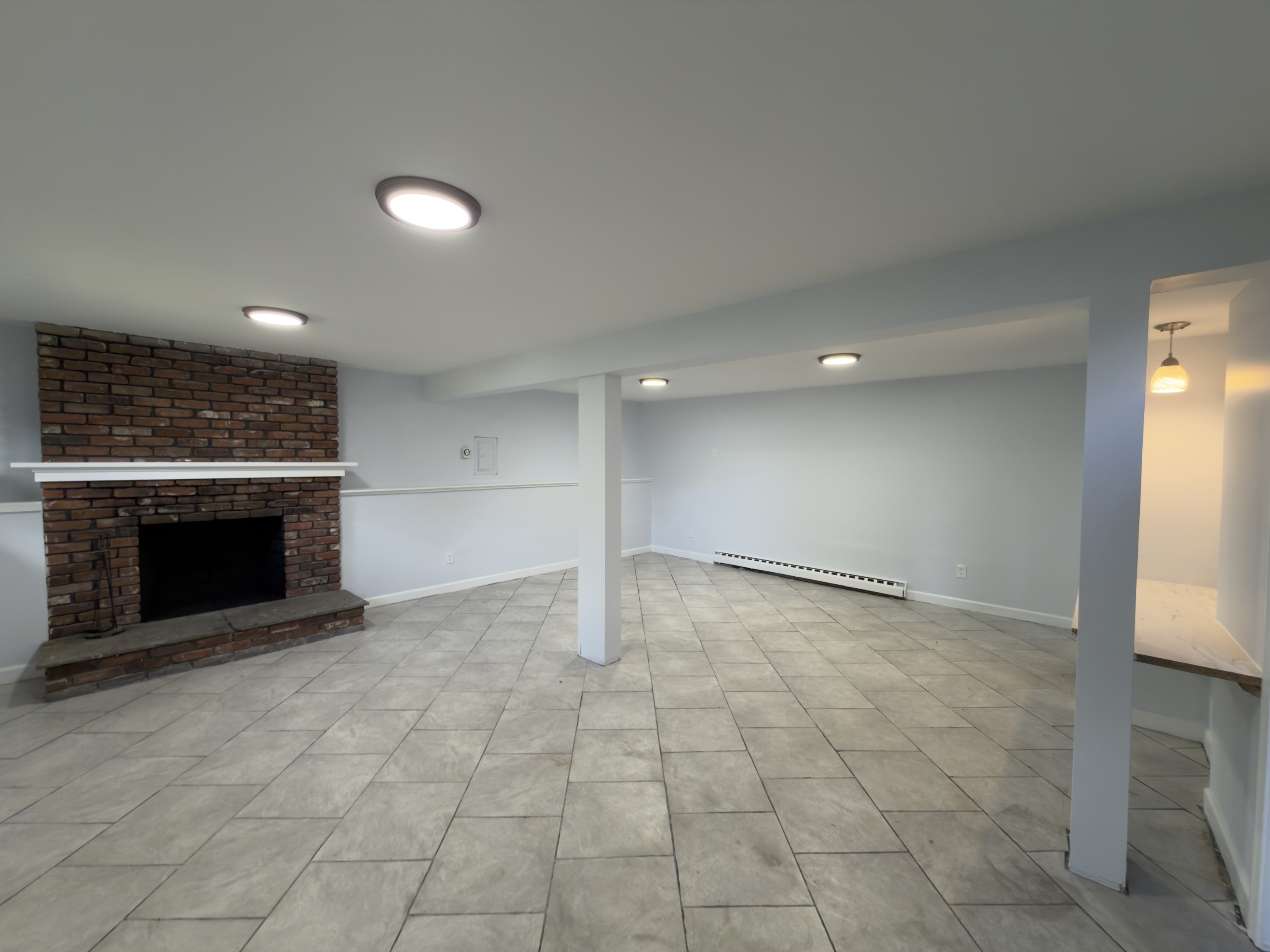 63 Haddad Road Waterbury, CT 06708 - Photo 3 of 30 an empty room with windows and fireplace