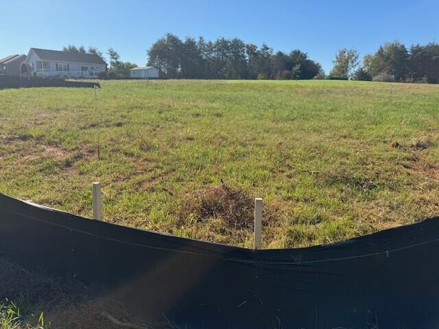 Lot 21 Scruggs Road Moneta, VA 24121 - Photo 2 of 3 a view of a lake from a yard