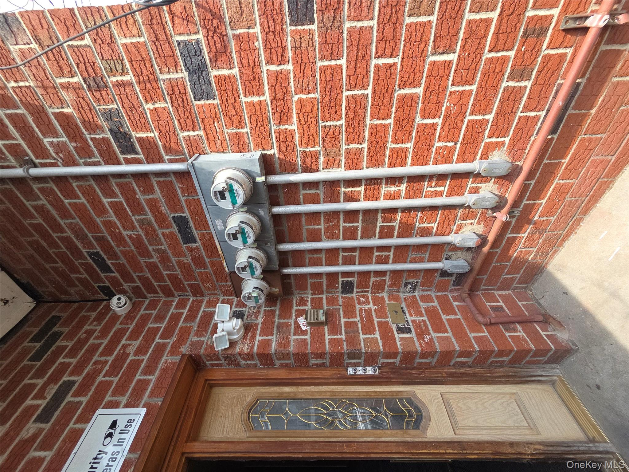 102-11 Strong Avenue Queens, NY 11368 - Photo 2 of 6 a front view of a building with a door and a window