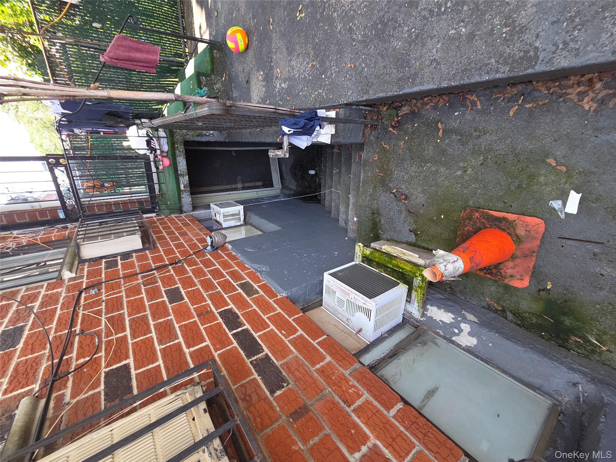 102-11 Strong Avenue Queens, NY 11368 - Photo 4 of 6 a view of a patio with table and chairs