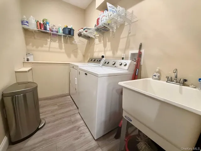 a bathroom with a sink mirror and vanity