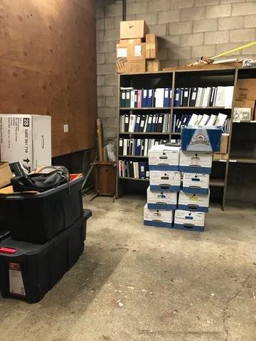 a room with a couch and a computer on the desk