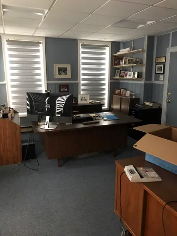 a front view of house with yard and outdoor seating