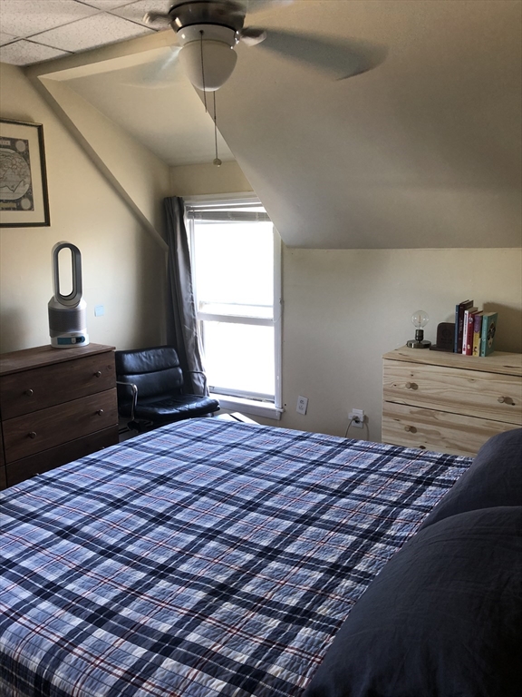 270-272 Sidney Street Cambridge, MA 02139 - Photo 17 of 24 a bedroom with a bed and a window