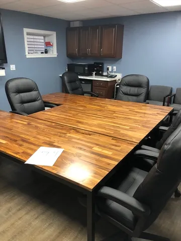 a bedroom with bed and cabinets