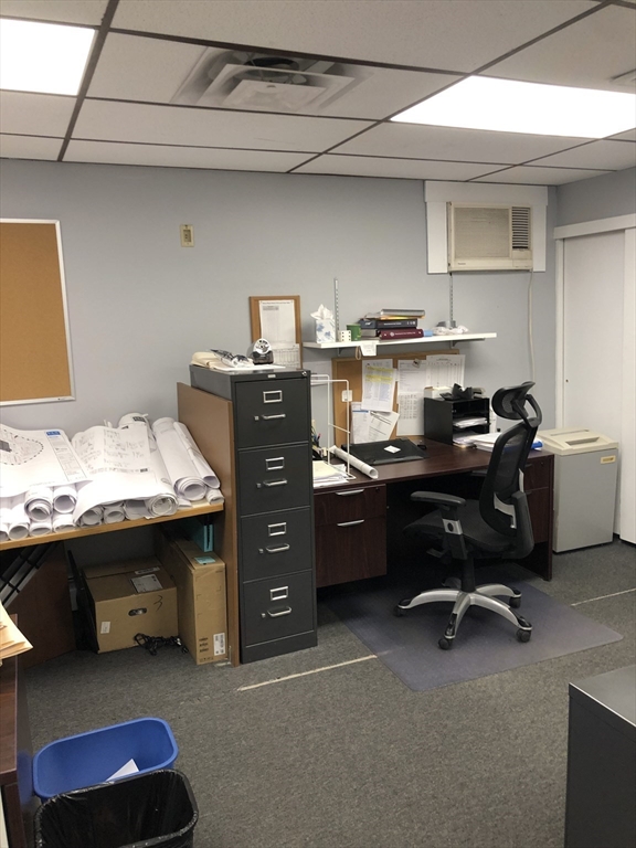 270-272 Sidney Street Cambridge, MA 02139 - Photo 7 of 24 a room with a desk and a dresser