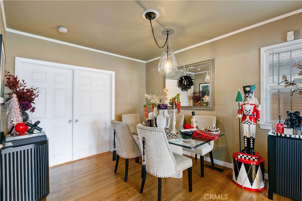 3907 Edgehill Drive Leimert Park, CA 90008 - Photo 12 of 38 a view of a dining room with furniture and wooden floor
