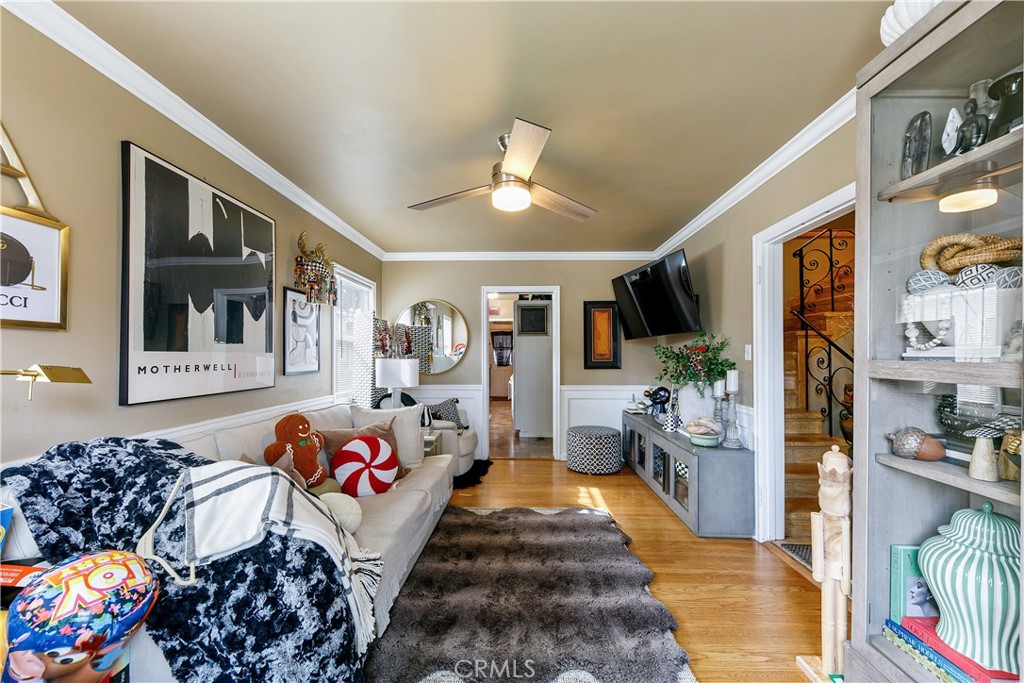 3907 Edgehill Drive Leimert Park, CA 90008 - Photo 18 of 38 a bedroom with furniture and a chandelier