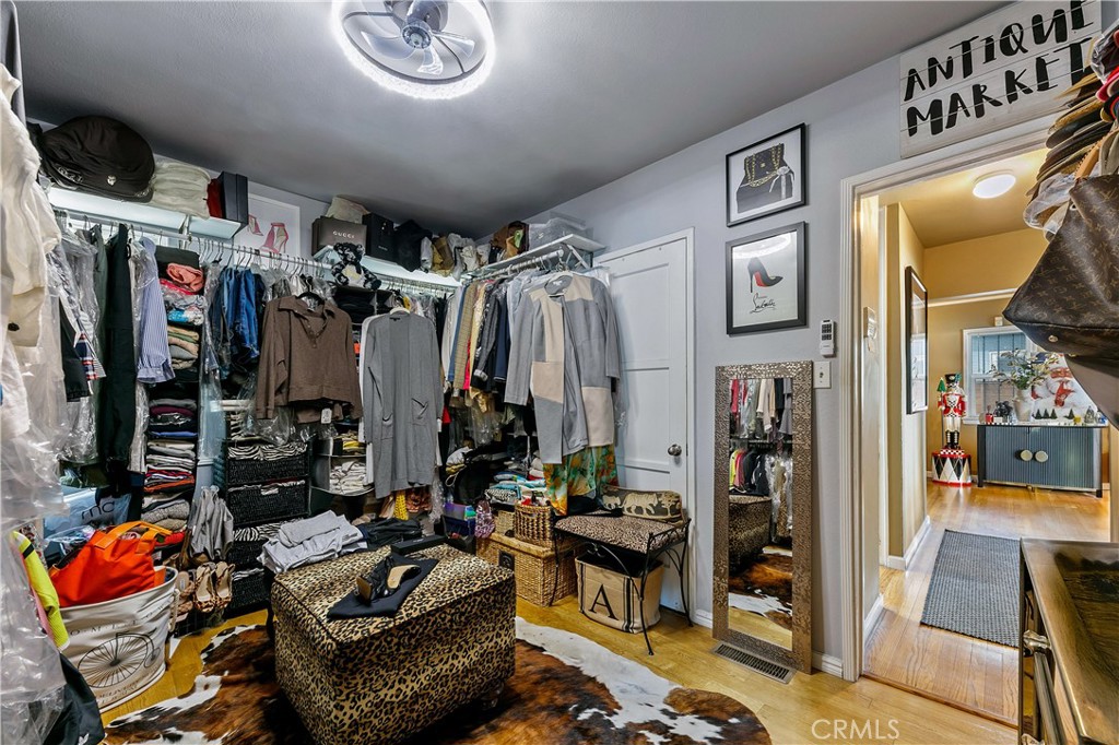 3907 Edgehill Drive Leimert Park, CA 90008 - Photo 25 of 38 a living room with lots of furniture and clothes