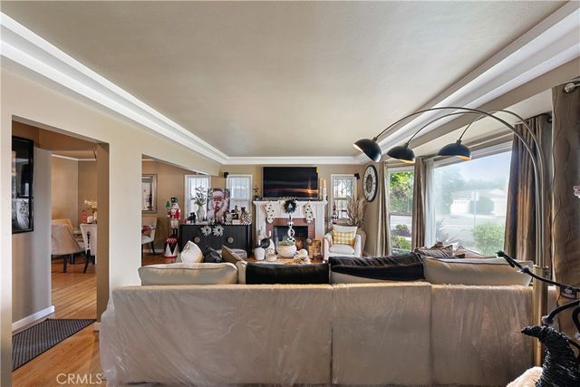 a living room filled with furniture and a large window