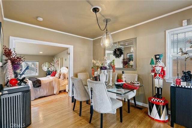 a view of a dining room with furniture and rug
