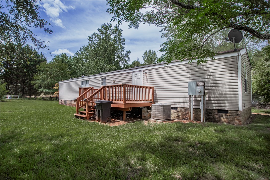 169 West Bagwell Road Liberty, SC 29657 - Photo 6 of 29 A robust rear deck offers access to the private yard, surrounded by mature trees.