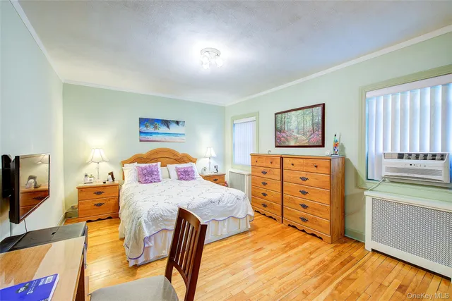 a bedroom with a bed and a view of bedroom