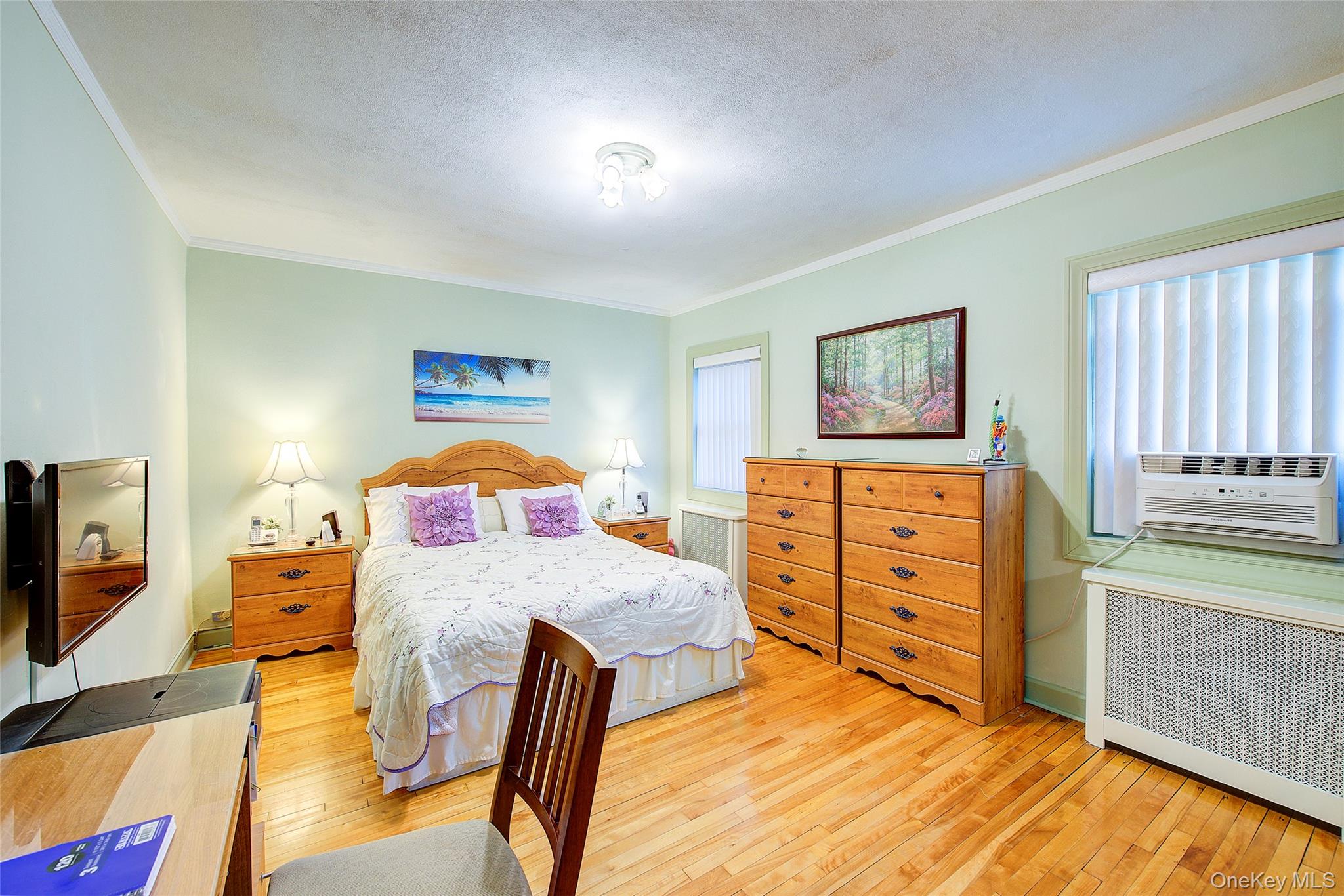 196-57 69th Avenue, Unit 1 Queens, NY 11365 - Photo 13 of 18 a bedroom with a bed and a view of bedroom