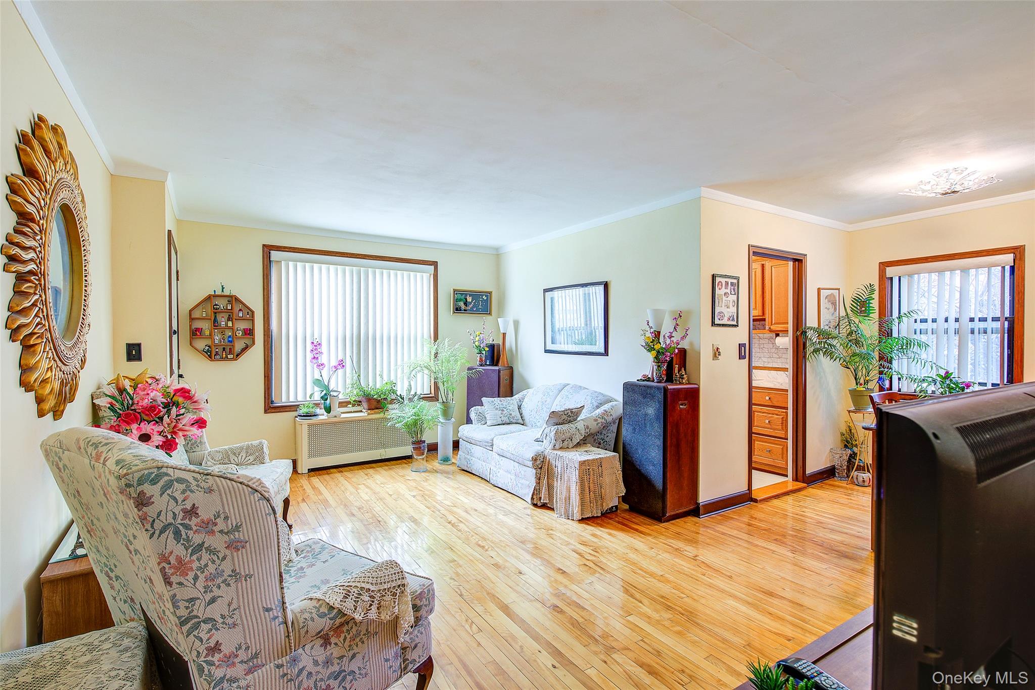 196-57 69th Avenue, Unit 1 Queens, NY 11365 - Photo 3 of 18 a living room with furniture and a window