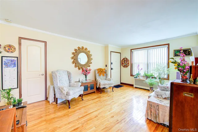 a living room with furniture gym equipment and a large window