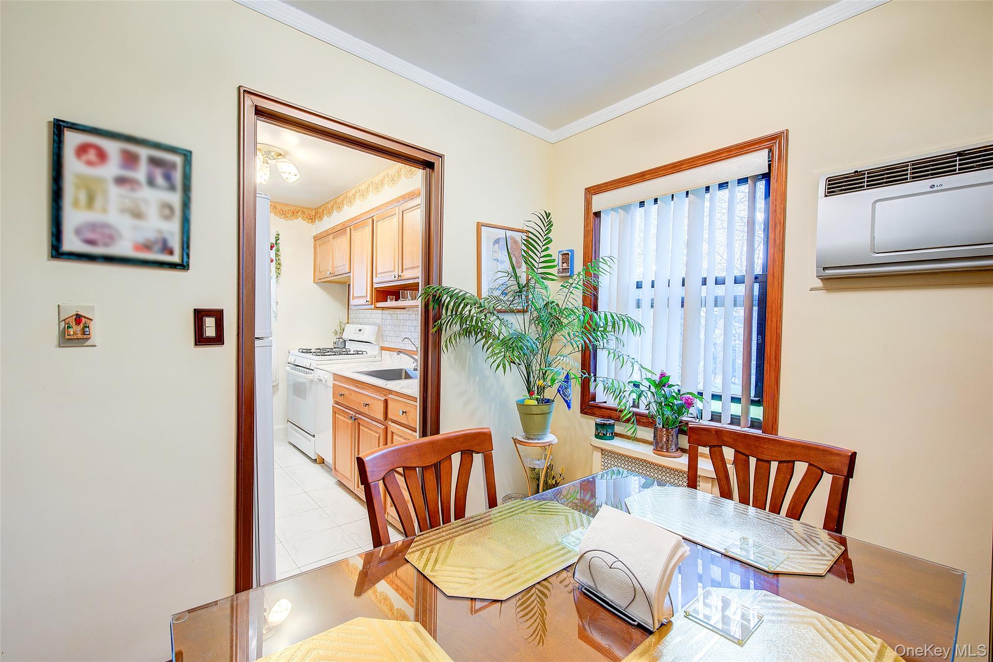 196-57 69th Avenue, Unit 1 Queens, NY 11365 - Photo 8 of 18 a living room with furniture and a painting on the wall