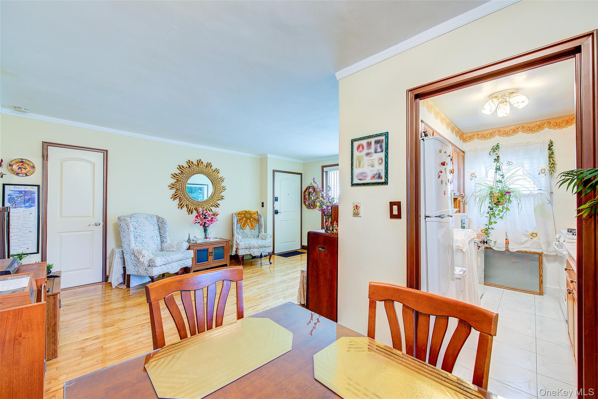 196-57 69th Avenue, Unit 1 Queens, NY 11365 - Photo 9 of 18 a living room with furniture and a table