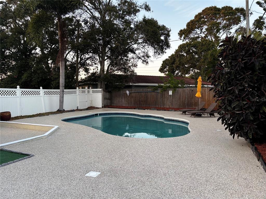863 Bay Breeze Terrace Largo, FL 33770 - Photo 17 of 19 a view of outdoor space and swimming pool