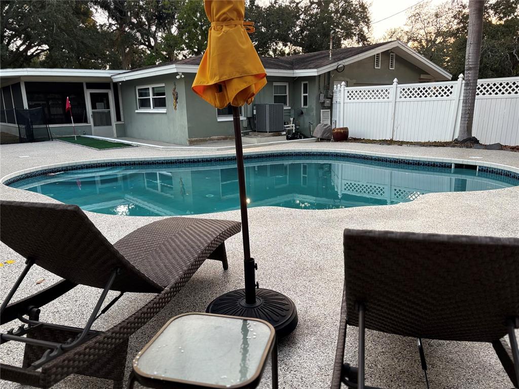 863 Bay Breeze Terrace Largo, FL 33770 - Photo 18 of 19 a front view of a house with garden