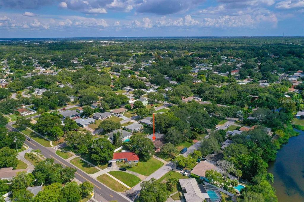 863 Bay Breeze Terrace Largo, FL 33770 - Photo 3 of 19 a view of a lush green field in front of the house