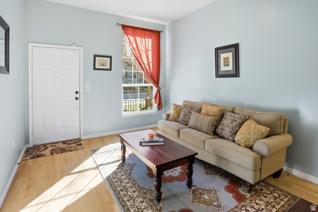 14820 175 East Draper, UT 84020 - Photo 4 of 39 Living room featuring baseboards and light wood-style flooring