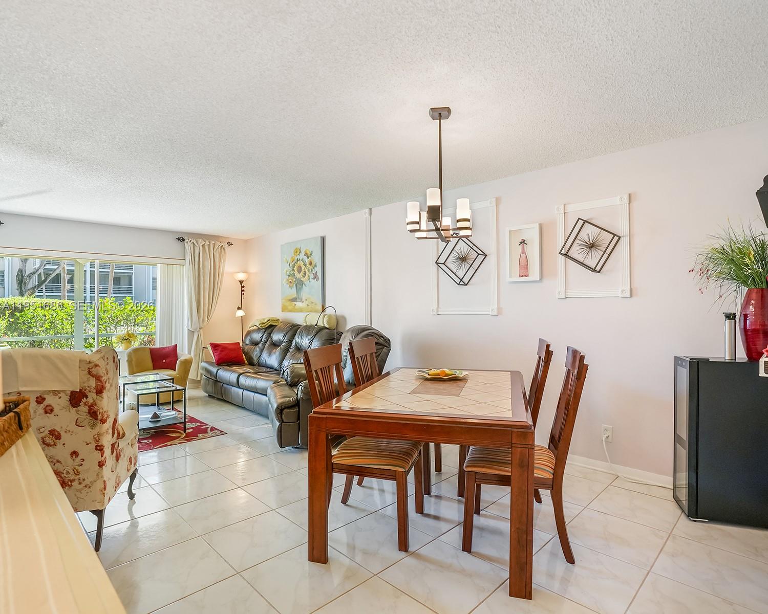 3531 Inverrary Drive, Unit 107 Lauderhill, FL 33319 - Photo 2 of 34 a view of a dining room with furniture