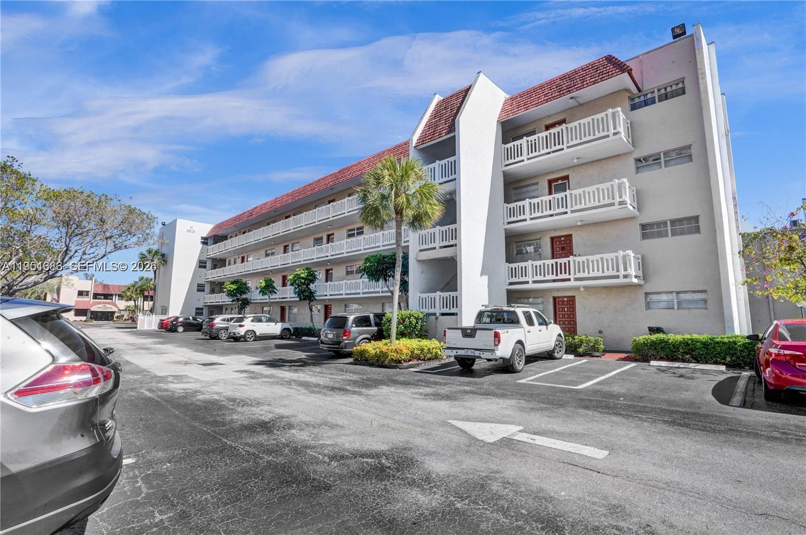 3531 Inverrary Drive, Unit 107 Lauderhill, FL 33319 - Photo 23 of 34 a car parked in front of a building