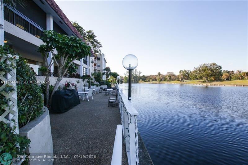 3531 Inverrary Drive, Unit 107 Lauderhill, FL 33319 - Photo 31 of 34 a view of a lake with a outdoor space