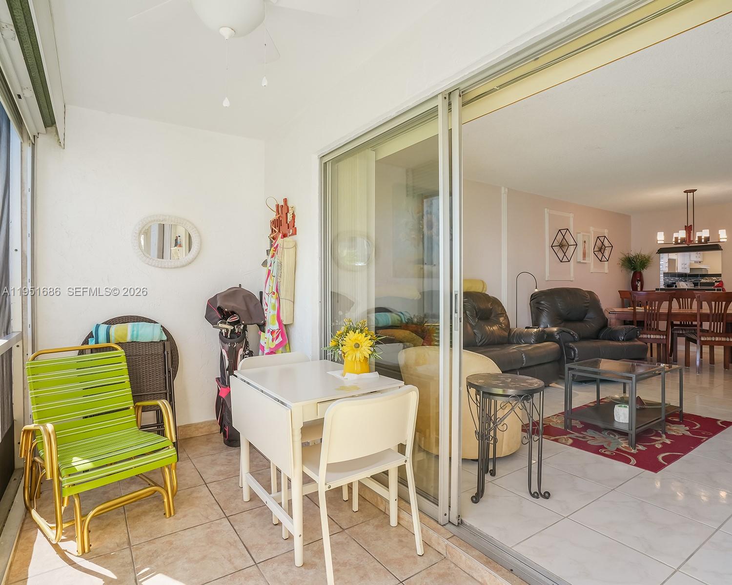 3531 Inverrary Drive, Unit 107 Lauderhill, FL 33319 - Photo 5 of 34 a living room with furniture and a table