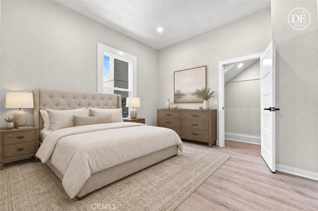 4224 Brockton Avenue Riverside, CA 92501 - Photo 29 of 55 Main level primary bedroom. The image is virtually staged.