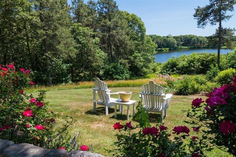 185 Ice Valley Road Osterville, MA 02655 - Photo 12 of 22 a view of a chairs and table in the garden