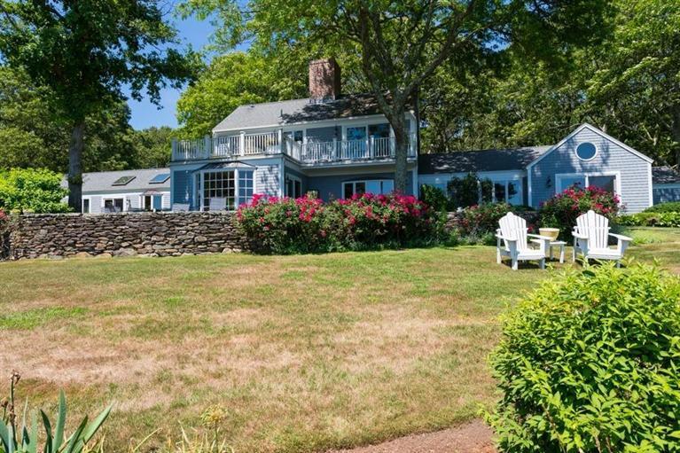 185 Ice Valley Road Osterville, MA 02655 - Photo 14 of 22 a front view of house with yard and trees around