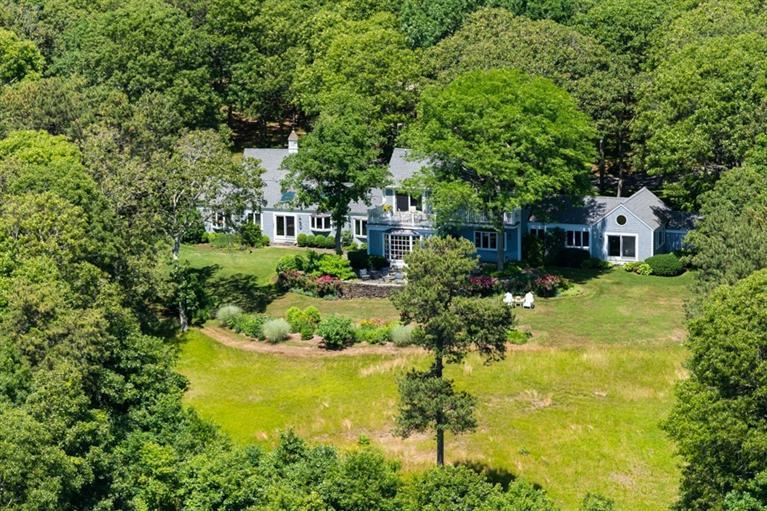 185 Ice Valley Road Osterville, MA 02655 - Photo 22 of 22 a swimming pool with trees in the background